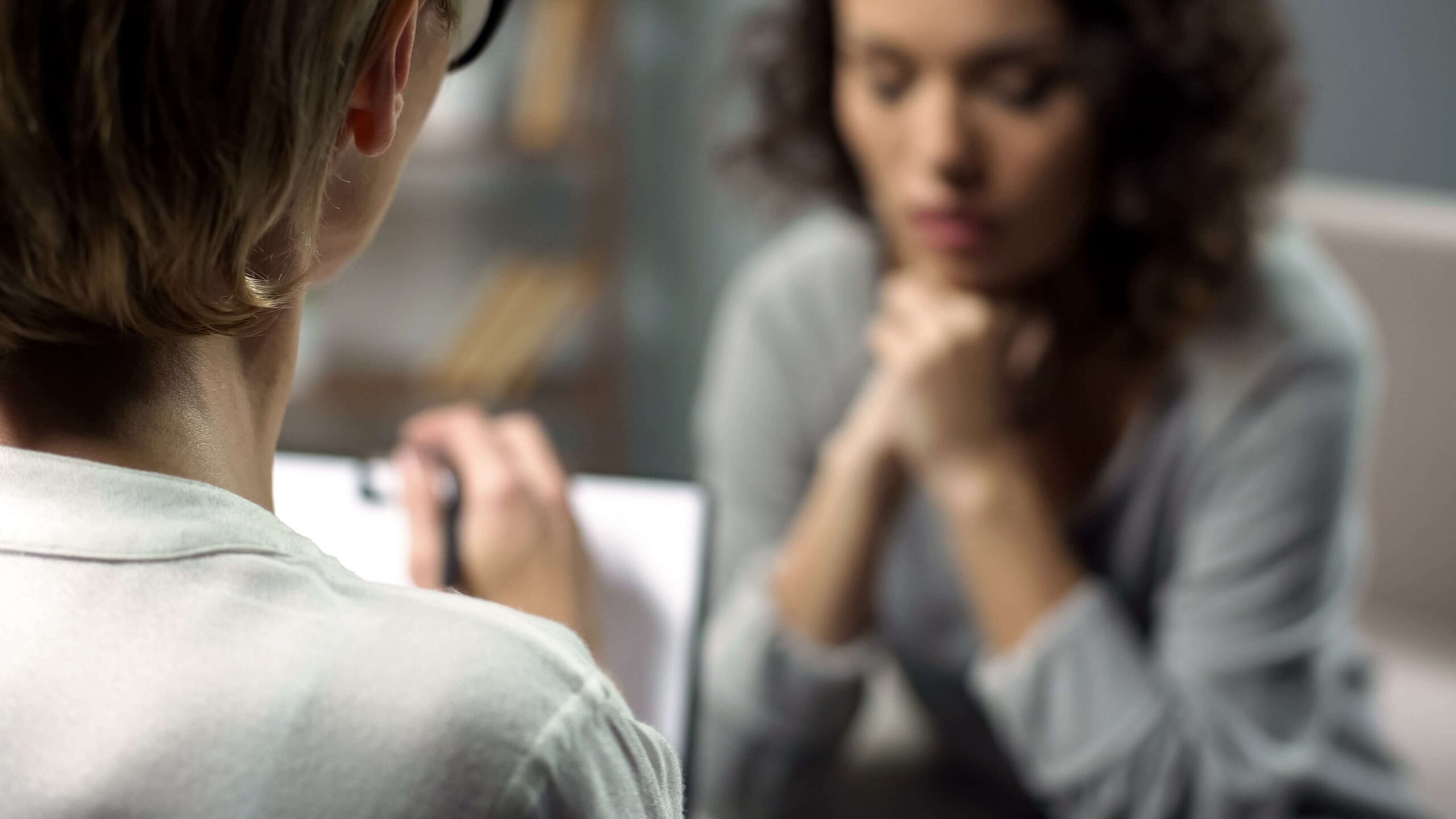 depressed woman getting a mental health diagnosis